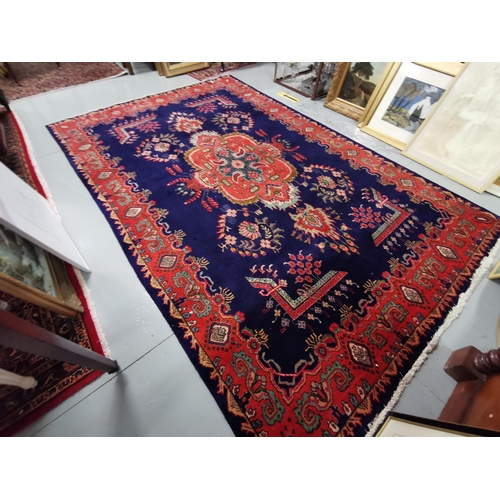 413 - Persian Rug, rich blue ground Sorok design, unique red, green medallion design with a red border, 2m... 