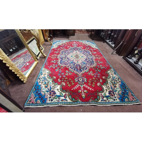 420 - Persian Wool Floor Rug, a red ground central medallion with turquoise corners, floral pattern, 2.8m ... 