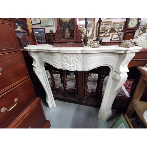 430 - Teak Fireplace, painted white, in the French style, with an ornate shell decorated frieze, 1.3mW x 1... 