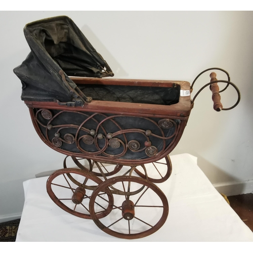 456 - Victorian Dolls Pram with wooden spoke wheels, decorative wicker fretwork, 56cmW