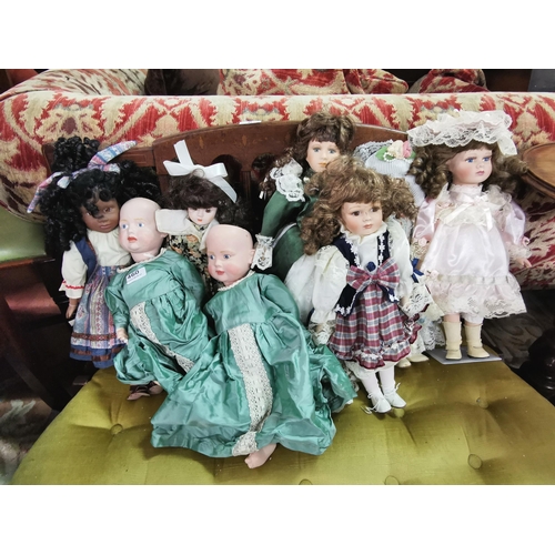 460 - 8 Porcelain Dolls, various colourful dresses (including 1 pair)