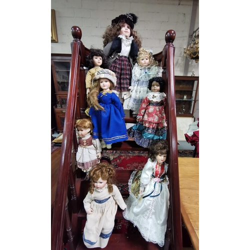 461 - 8 Porcelain Dolls, various colourful dresses