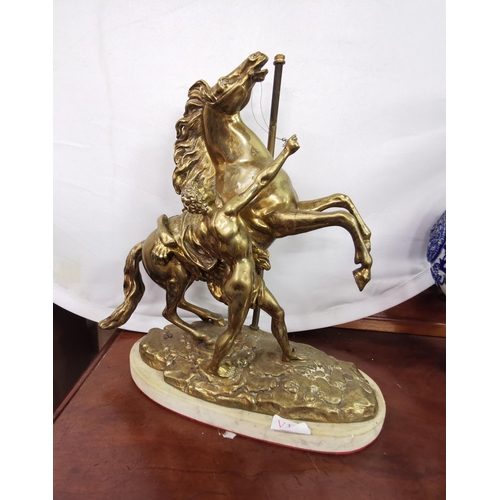 492 - Continental Brass Marli Horse with handler (once converted to a table lamp), stamped (illegibly) at ... 