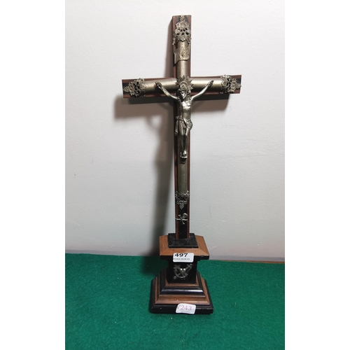 497 - Metal figure of a crucifix, on an ebony coloured plinth, with anchor and cross bow symbols (possibly... 