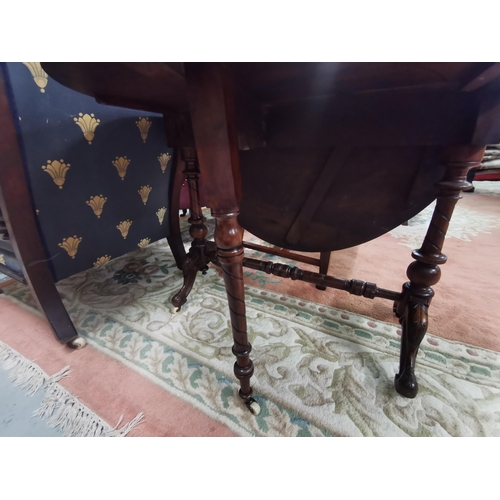 71 - Victorian Walnut Sutherland Table with oval-shaped drop ends, on turned legs, cabriole toes, porcela... 