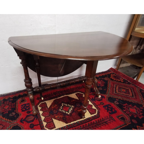 71 - Victorian Walnut Sutherland Table with oval-shaped drop ends, on turned legs, cabriole toes, porcela... 