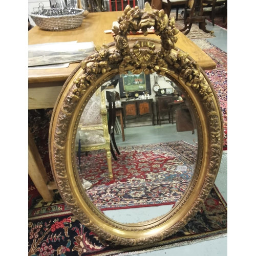 206 - Oval Shaped Gilt Frame Wall Mirror, ornate borders, shaped pediment and bevelled glass, 70cmW x 95cm... 