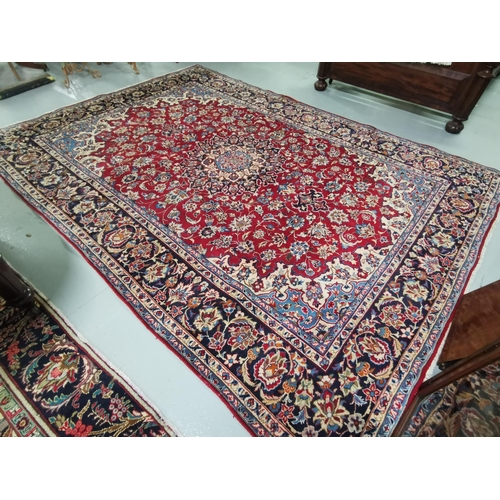 407 - Persian blue and red ground Najafabad Carpet of Isfahan region of Iran, fine woven, 3.55m x 2.52m