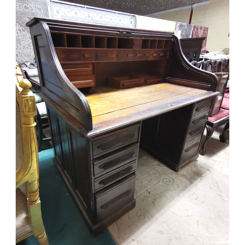 386 - Oak Dickens Style Roll Top Desk, with interior compartments and drawers on either side, panelled sid... 