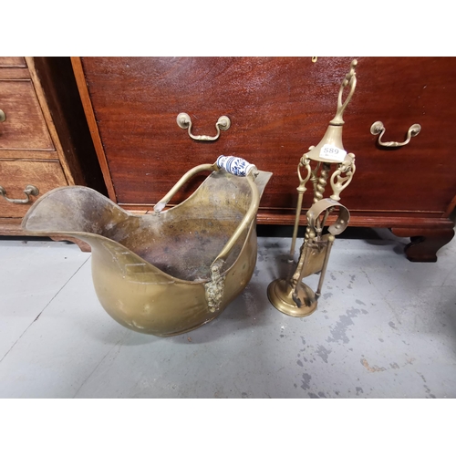 589 - Brass Vintage era Fire side items incl. a companion set and helmet shaped bucket