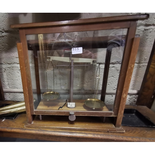 515 - Scientific Scales (stamped WBN Glasgow) in an oak framed glass cabinet, 39cmH x 45cmW