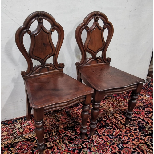 16 - Matching Pair of Victorian Mahogany Hall Chairs, with shield shaped backs, on turned front legs