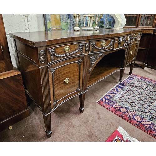 187 - Large 19thC Mahogany Sideboard - serpentine shaped – with three apron drawers – decorated with flora... 