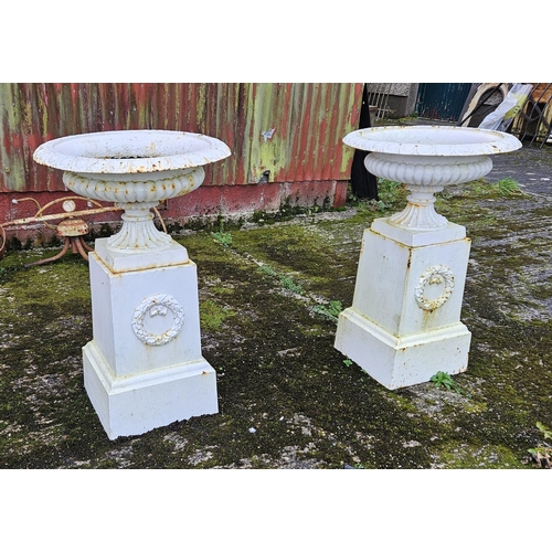 445 - Matching Pair of white painted cast iron Garden Urns - campana form - each upon a square pedestal ba... 