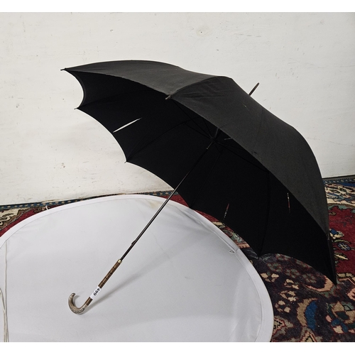 499 - Vintage Black Umbrella with an English hallmarked silver tip to the handle