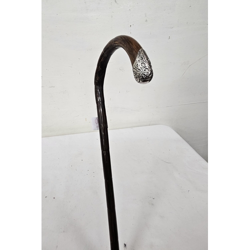 500 - Walking Stick with a bamboo style body and a hallmarked silver mounted tip