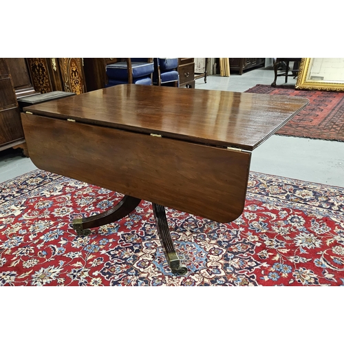 79 - Regency Mahogany Dining Table on a tripod splayed leg base with cast brass toes and castors (varnish... 