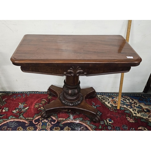 86 - WMIV Mahogany Card Table, fold-over design with a blue baize interior and game/token wells, on a mou... 