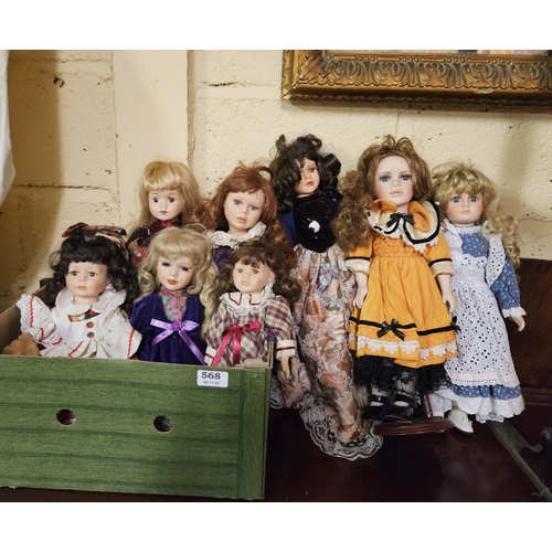 568 - 8 Porcelain Dolls (4 are small), all wearing dresses