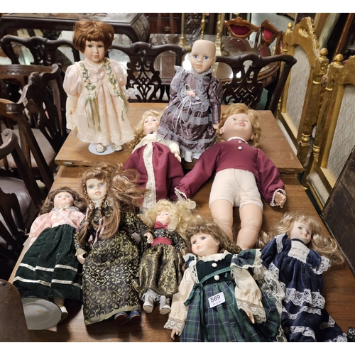 569 - 9 Dolls (8 are porcelain), in various costumes