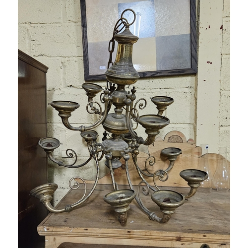 576 - Pair of large brass Ceiling Lights (worn), each with 12 branches (also with 17 green glass globes)