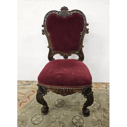 31 - Irish Victorian carved Rosewood Side Chair, the curved back above a red velour covered seat and back... 