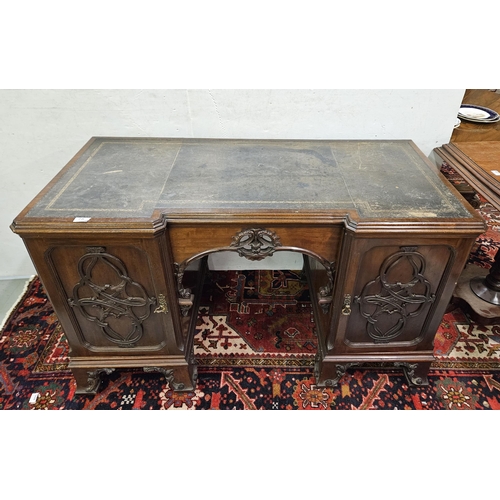 75 - 19thC Kneehole Mahogany Desk, with decoratively carved frieze and a green tooled leather top, cabine... 