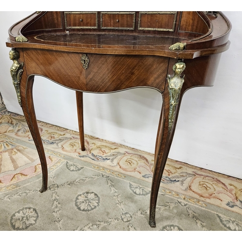 106 - Early 20thC Continental Writing Desk, oval shaped with brass mounted figures of cherubs, a dark brow... 