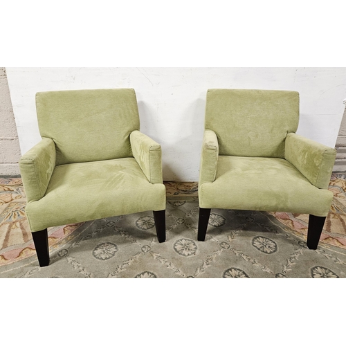 12 - Matching Pair of Duff Tisdall contemporary Armchairs, covered with olive green fabric, on tapered fr... 