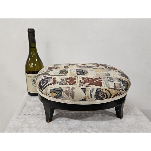 16 - Low Foot Stool, oval shaped, on 4 sabre feet, covered with abstract fabric, 37cmW