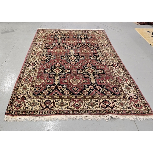 169 - Persian Floor Rug, Caucasian design, deep pink ground with navy and cream medallions, 2.5m w 1.76cm