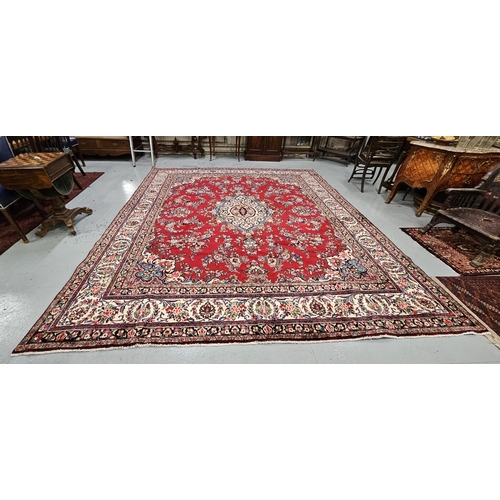 171 - Rich red ground full pile Persian Tabriz Carpet, with a central floral medallion and a field of flor... 