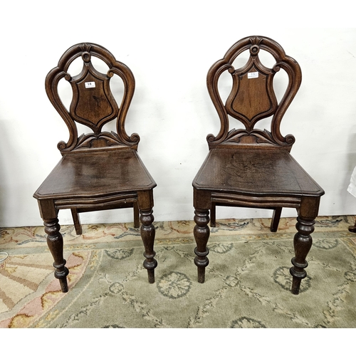 18 - Matching Pair of Victorian Mahogany Hall Chairs, with shield shaped backs, on turned front legs