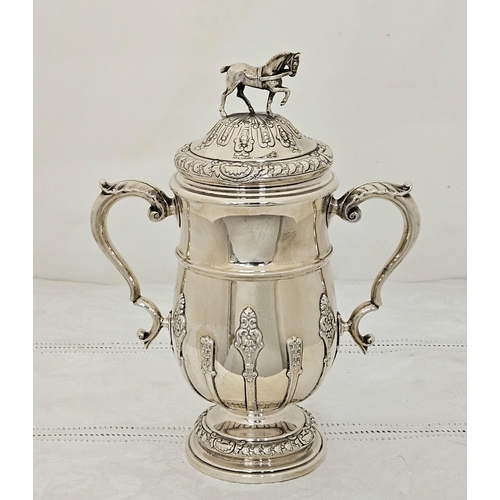 222 - Birmingham Solid Silver Trophy Cup with handles and a lid with carriage horse finial, leaf decorated... 