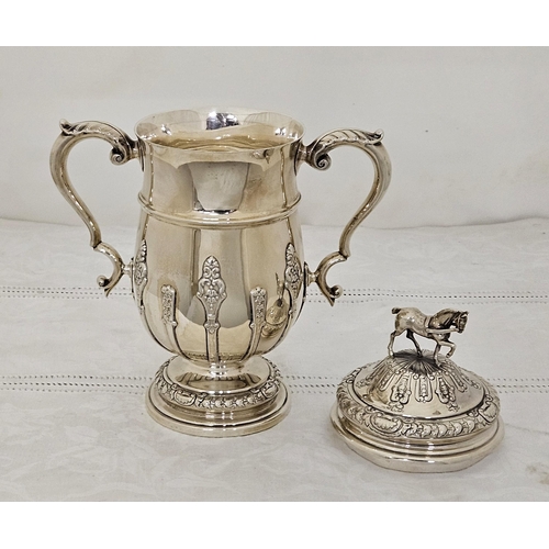 222 - Birmingham Solid Silver Trophy Cup with handles and a lid with carriage horse finial, leaf decorated... 