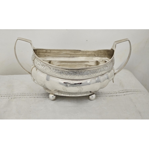 229 - Large Irish Georgian Silver Sugar Bowl, boat shaped with side handles, floral chased borders, on 4 b... 