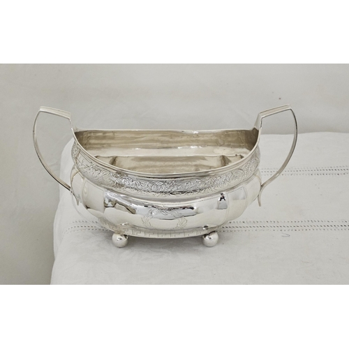 229 - Large Irish Georgian Silver Sugar Bowl, boat shaped with side handles, floral chased borders, on 4 b... 