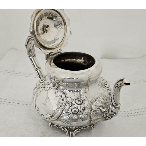 230 - Victorian Irish Silver Teapot, very decorative, with a floral finial and bird spout, chased floral d... 