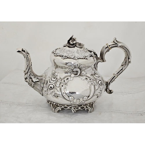 230 - Victorian Irish Silver Teapot, very decorative, with a floral finial and bird spout, chased floral d... 