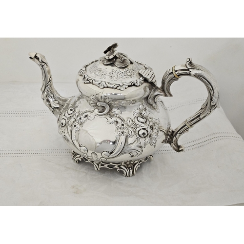 230 - Victorian Irish Silver Teapot, very decorative, with a floral finial and bird spout, chased floral d... 