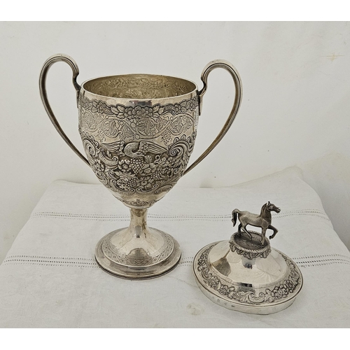 233 - Fine and Rare large Solid Silver Trophy Cup on a plinth base, with handles and a highly floral and e... 