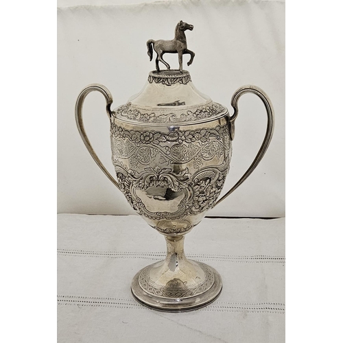 233 - Fine and Rare large Solid Silver Trophy Cup on a plinth base, with handles and a highly floral and e... 