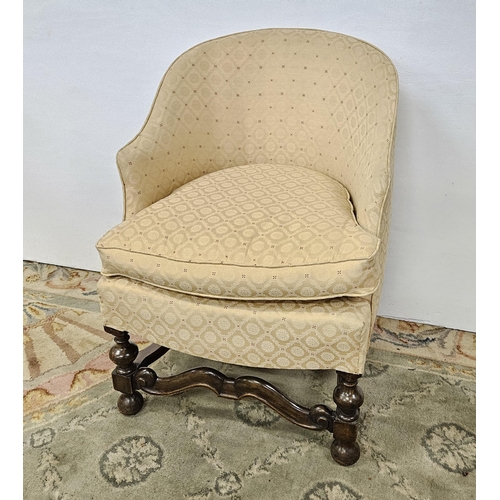 27 - Oak framed Tub Shaped Armchair, with a Tudor style stretcher and bun feet, covered with dark beige f... 