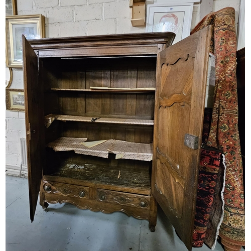 323 - 18thC Tall French Oak Armoire, the shaped and moulded pediment over 2 doors supported by forged iron... 