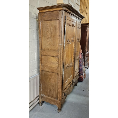 323 - 18thC Tall French Oak Armoire, the shaped and moulded pediment over 2 doors supported by forged iron... 