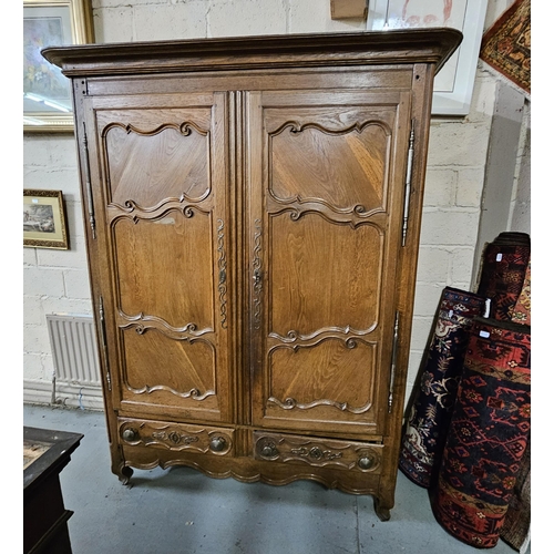 323 - 18thC Tall French Oak Armoire, the shaped and moulded pediment over 2 doors supported by forged iron... 