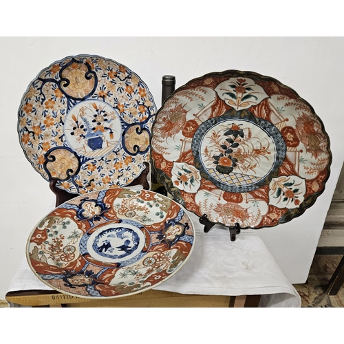 375 - 3 Imari Plates  2 traditionally decorated with a bowl of flowers with shaped borders 30cm dia & 1 p... 