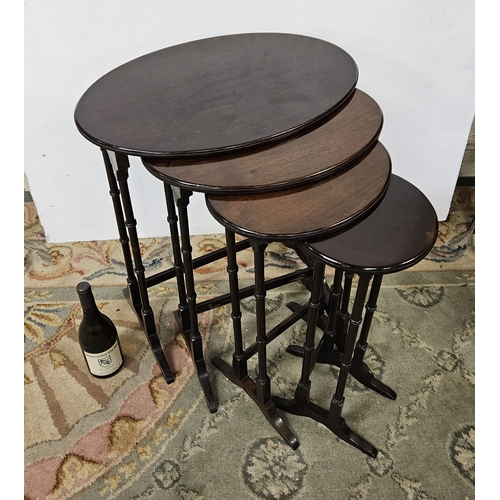 54 - Nest of 4 Mahogany Tables, with oval shaped tops, on spindle legs, 1980s, (largest 58cmW x 68cmH)