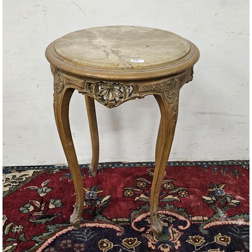 53 - Circular Occasional carved red beech Table, on cabriole legs, the top inset with dark beige marble, ... 