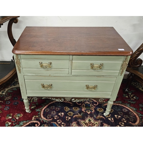 64 - Low sized Chest of two Drawers, painted green, with brass handles, a walnut top, on turned legs, cas... 